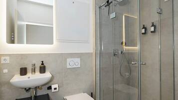 Shower, hair dryer, towels, shampoo