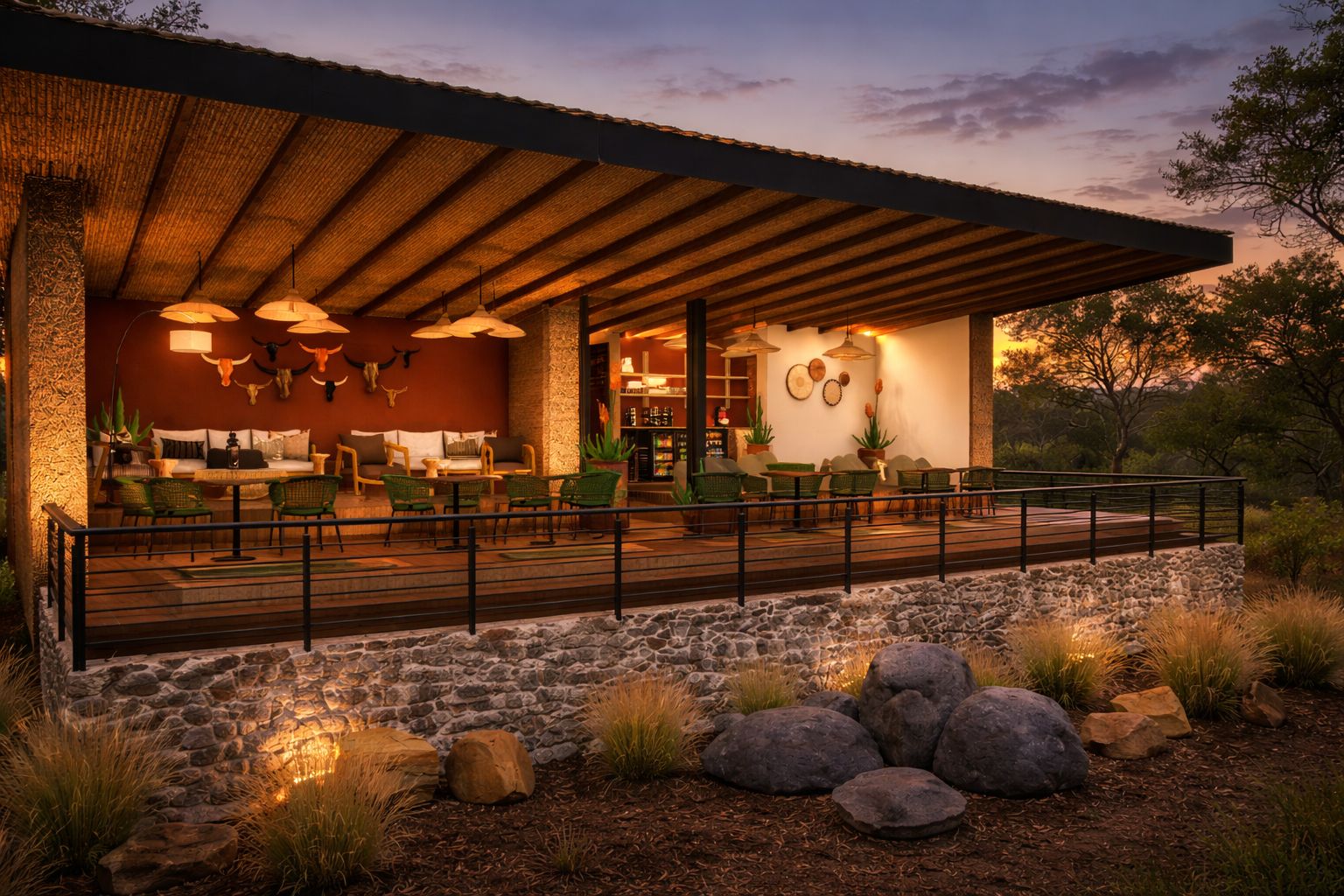 A covered outdoor seating area with stone walls and a wooden deck, furnished with chairs and tables.