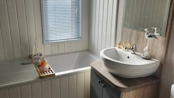 Combined shower/bathtub, deep-soaking bathtub, towels
