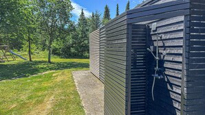A wooden exterior wall with a metal door and a small window. - Pet friendly home in Fur with WiFi (Fur)