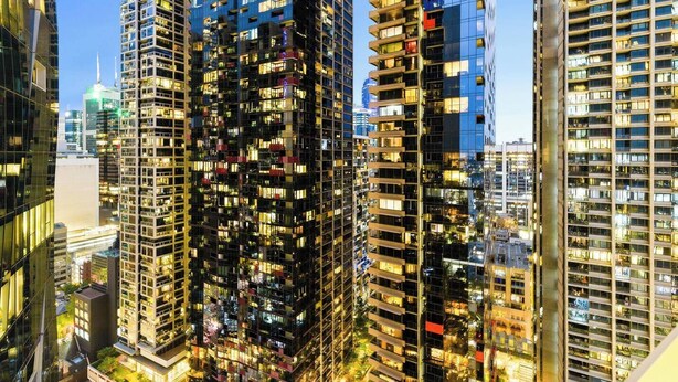 A high-rise building with multiple floors, large windows, and a modern architectural design. - Puddings Designer 2B2B WSP | CBD Southern Cross (Melbourne)