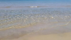 A beach with clear water and a sandy shore. - 'Dimora Del Principe' with Sea View, Wi-Fi and Air Conditioning (Principe)