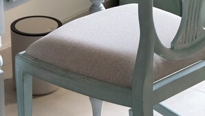 A light blue wooden desk with a drawer and a chair with a cushioned seat. - Island Club Guest House (Sliema)