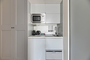 Microwave, stovetop, coffee/tea maker, electric kettle