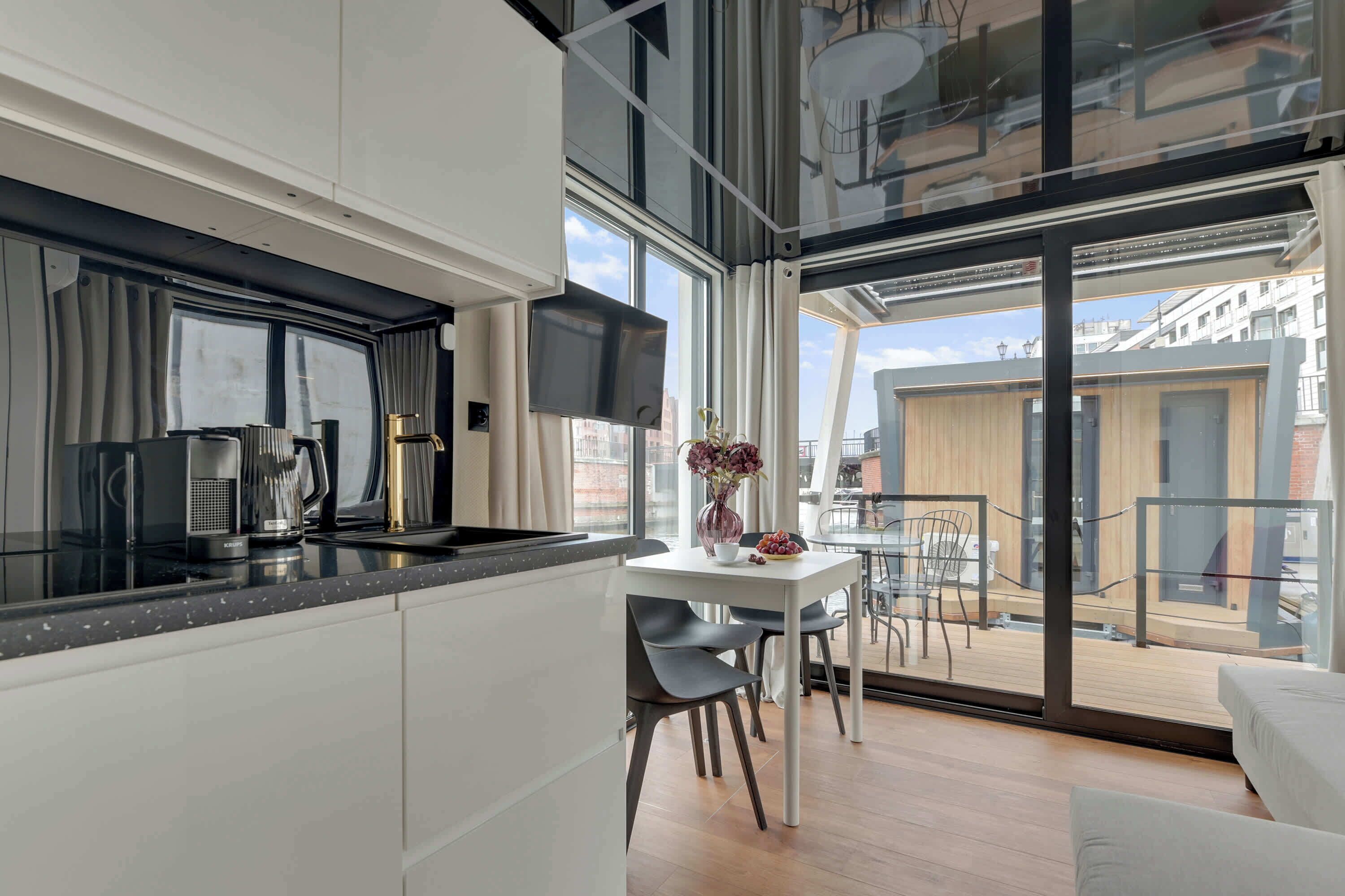Fridge, stovetop, dishwasher, coffee/tea maker