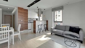 A modern apartment with a kitchen, dining area, and living room. - Browar Gdański | Best Location (Gdańsk)