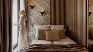 A bedroom with a bed, pillows, a window, and curtains. - Sol Marina Harmony | Perfect View (Gdańsk)