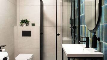Shower, hair dryer, towels, shampoo