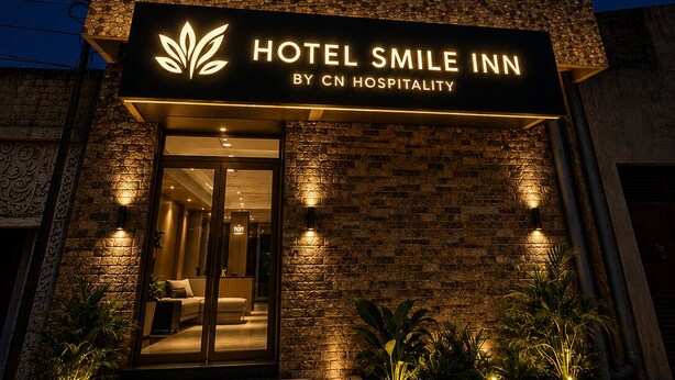 A multi-story building with a sign for 'Hotel Smile Inn by CN Hospitality.' - Hotel Smile Inn-Next Railway Station (Bhubaneshwar)