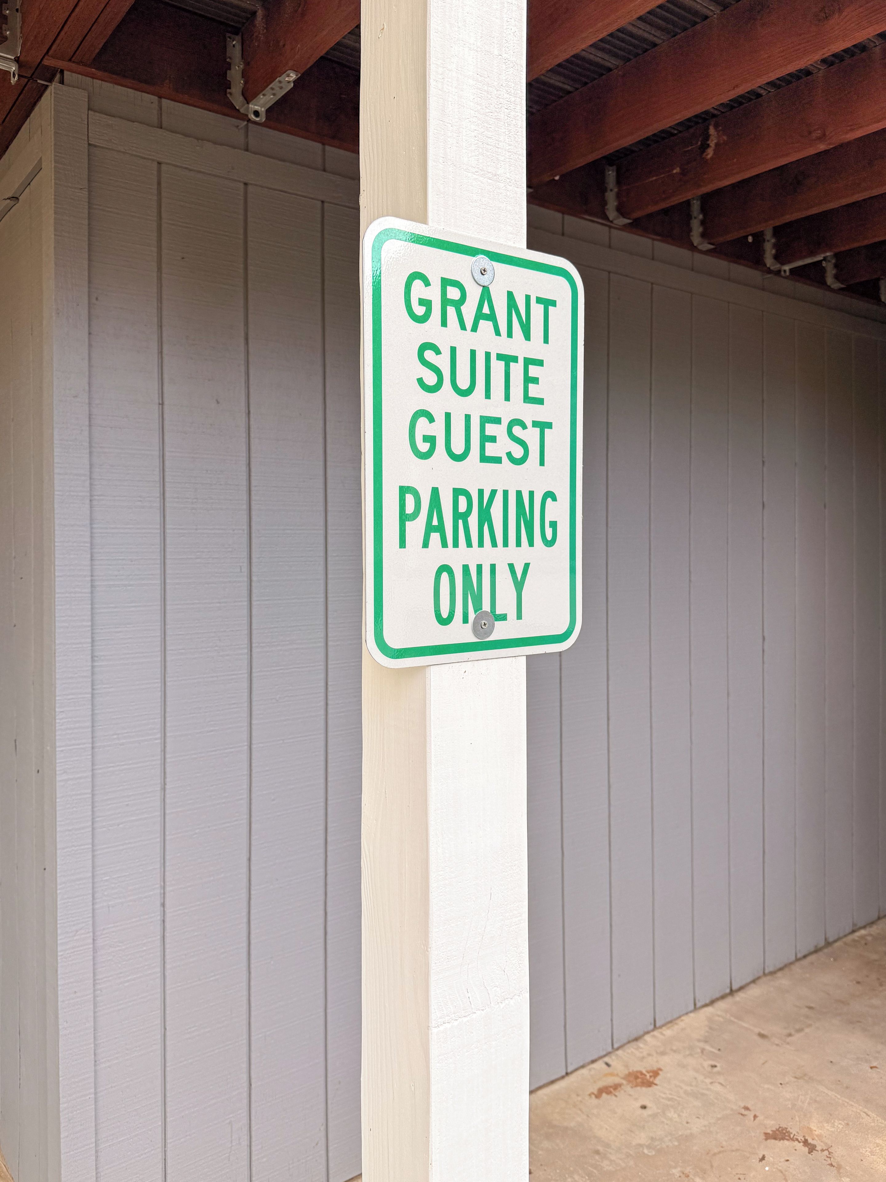 A sign indicating 'Grant Suite Guest Parking Only.'