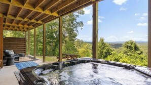 A hot tub under a wooden pergola with a scenic view. - Roscoe's Retreat Stay (Blue Ridge)