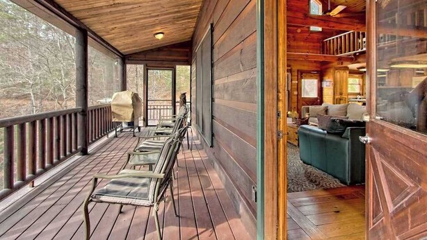 A wooden deck with chairs, a sofa, and a dining table. - Best Kept Secret Stay (Blue Ridge)