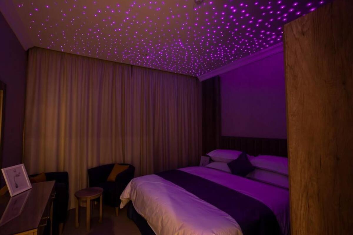 Family Suite, Garden View | In-room safe, blackout drapes, soundproofing, iron/ironing board