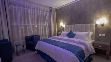 Family Studio Suite, Garden View | In-room safe, blackout drapes, soundproofing, iron/ironing board