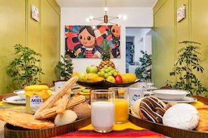 A breakfast buffet with various pastries, fruits, and beverages. - Condesa 7-suite villa · hot tub & pool table (Mexico City)