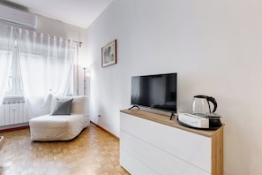 Habitación cuádruple Confort | Área de sala de estar