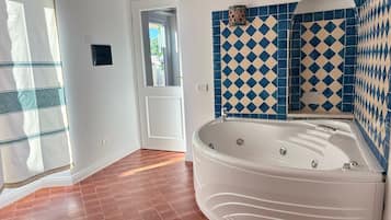 Luxury Suite, Mountain View | Bathroom | Separate bathtub and shower, hair dryer, towels, toilet paper