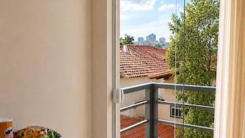 Suíte conforto, vista para a cidade | Parte interna