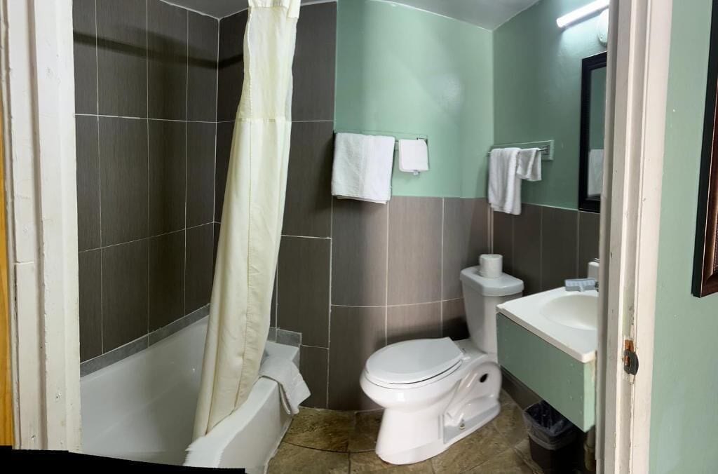 Standard Double Room, 2 Queen Beds, Smoking | Bathroom | Designer toiletries, towels, soap, shampoo