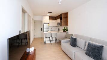 Deluxe Apartment, City View | Living area | LED TV