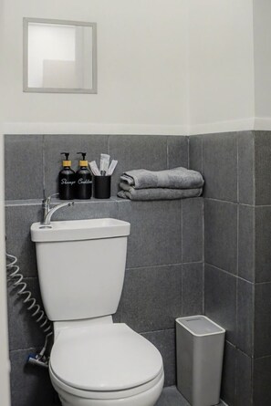 Shower, bidet, towels - Modern Studio Living at Urban Deca Towers Cubao (Quezon City)