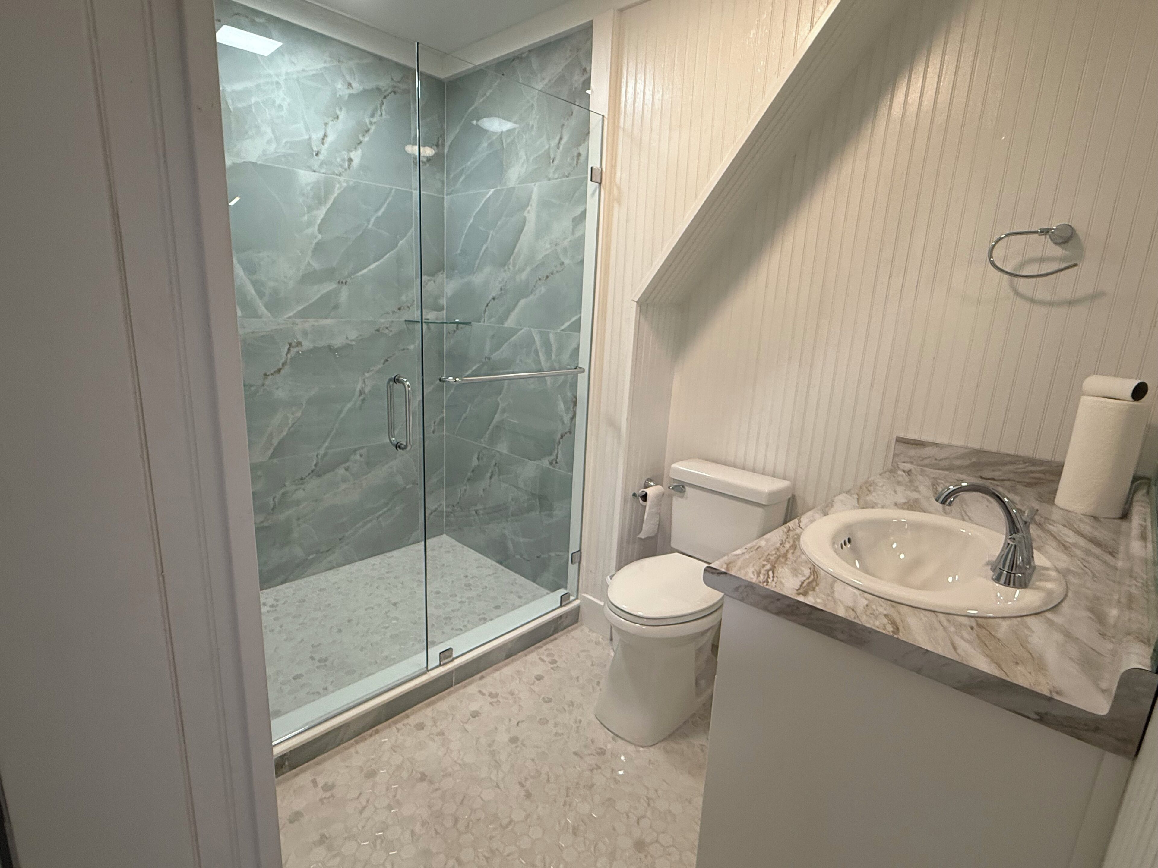 Shower, hair dryer, towels, soap