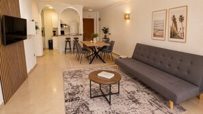 TV - Palm Beach Apartment with Pool, Parking, and Sea View in Fuengirola (Fuengirola)