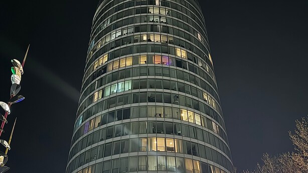 A tall, cylindrical building with multiple floors and large windows. - The Bullring Studio in Birmingham City Centre (Birmingham)