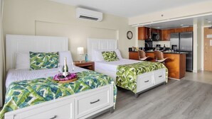 A hotel room with two beds, a kitchenette, and an air conditioning unit. - Suite, Ocean View, Studio (Honolulu)