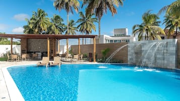 Indoor pool, open 9:00 AM to 6:30 PM, pool umbrellas, pool loungers