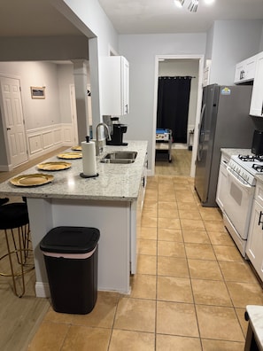 Fridge, microwave, oven, stovetop - “3BR Townhome w/ Game Room  Pool Table + Garage” (Norcross)