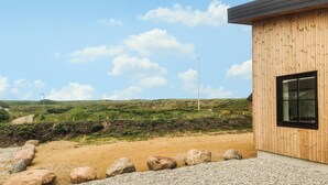 A modern building with a wooden exterior and a large window. - Amazing home in Vestervig with WiFi (Vestervig)