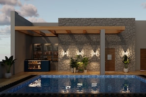 A modern building with a stone facade, a pool, and a bar area with a menu. - Ramada Encore by Wyndham Vrindavan Rukmani Vihar (Vrindavan)