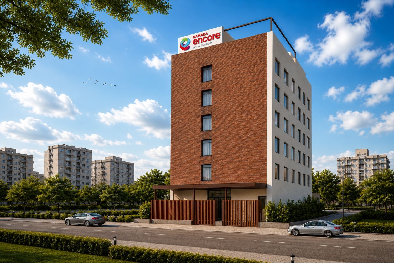 Un edificio moderno con un letrero llamativo de Ramada Encore by Wyndham.