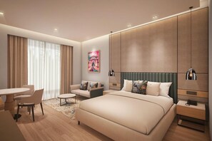 A modern hotel room with a large bed, a sitting area with a table and chairs, a painting on the wall, and built-in wardrobes. - Ramada Encore by Wyndham Vrindavan Rukmani Vihar (Vrindavan)