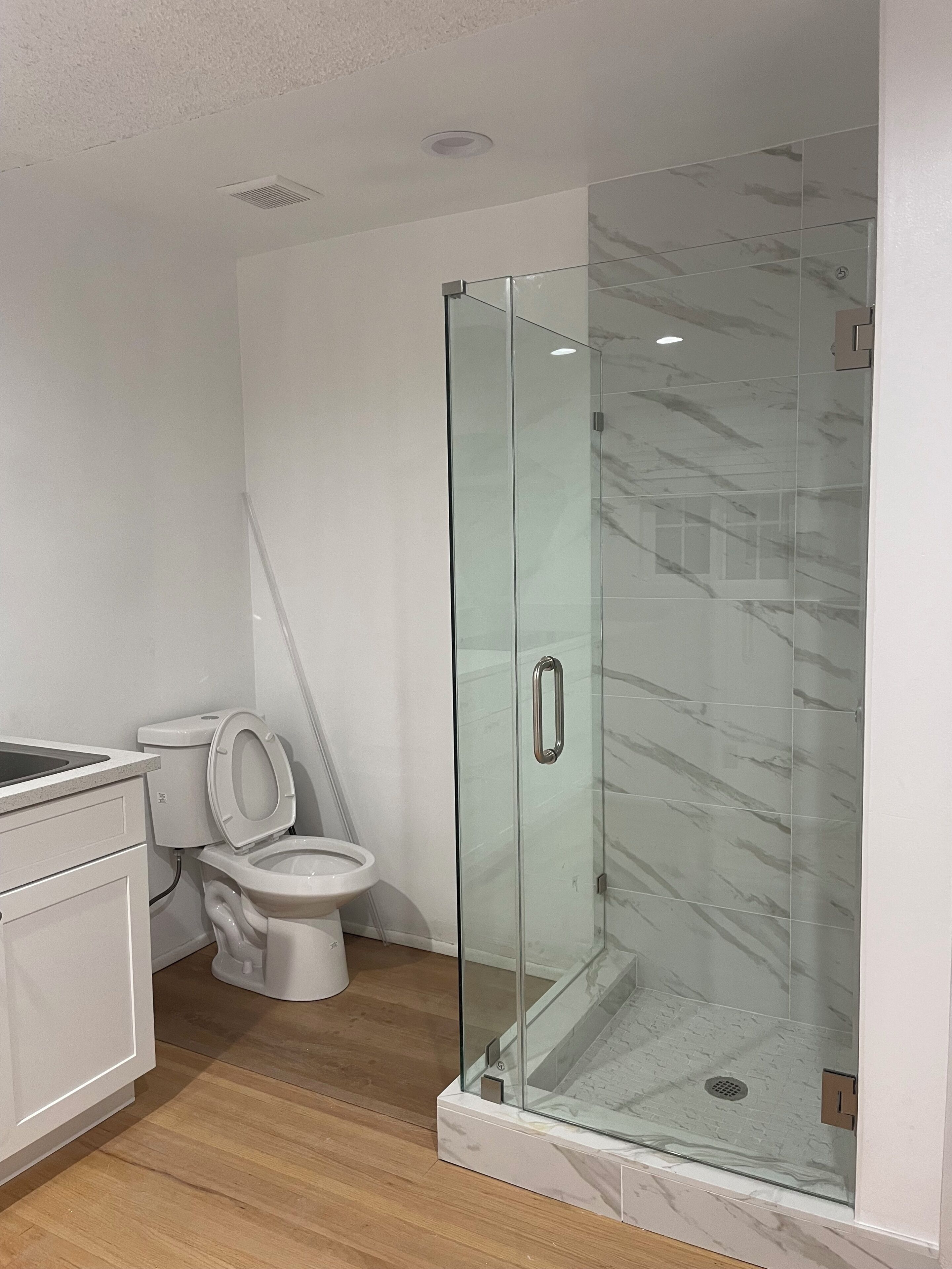 Shower, towels, soap, toilet paper
