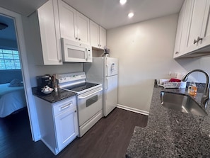 Coffee/tea maker, fridge, microwave, oven