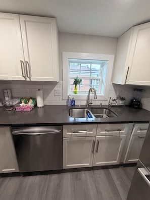 Coffee/tea maker, fridge, microwave, oven