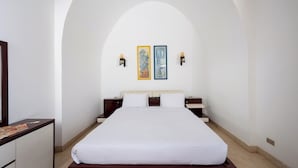 A hotel room with a large bed, a dresser, and two wall-mounted lamps. - VESTA - Luxury Villa - 4BR - North Golf (II) (El Gouna)