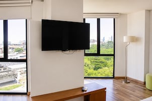 Superior Room, City View | Minibar, in-room safe, desk, iron/ironing board