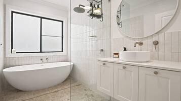 Shower, hair dryer, towels, shampoo