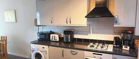 Coffee/tea maker, fridge, microwave, oven
