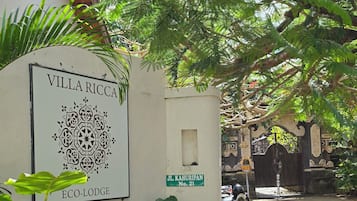A villa named 'Villa Ricca' with a sign indicating 'Eco-Lodge' and 'J.L. Kahuripan No. 21'.