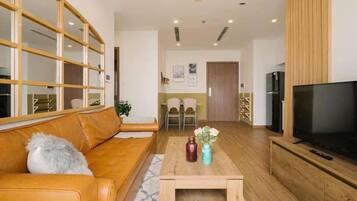 Luxury Apartment, 2 Bedrooms, City View, Tower | Living area | 65-inch flat-screen TV with cable channels