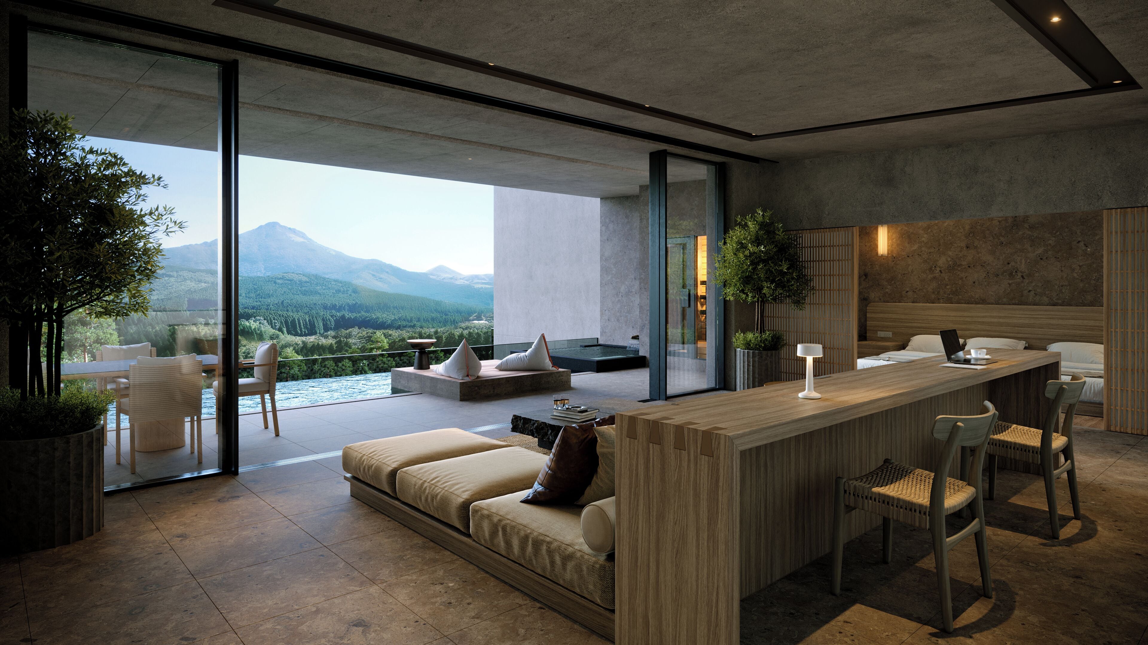 A modern interior with a large sliding glass door leading to a balcony, a wooden bar area, and a seating arrangement with a view of the mountains.