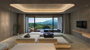 A modern hotel room with a large window, a flat-screen TV, and a sofa. - seven x seven YUFUIN (Yufu)