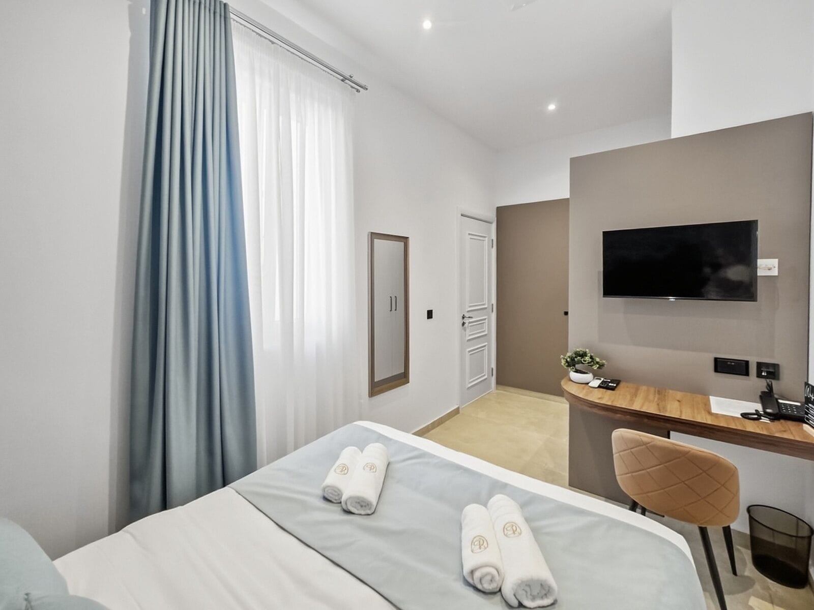 Deluxe Double Room, Courtyard View (Suite 102) | Desk, laptop workspace, blackout drapes, iron/ironing board