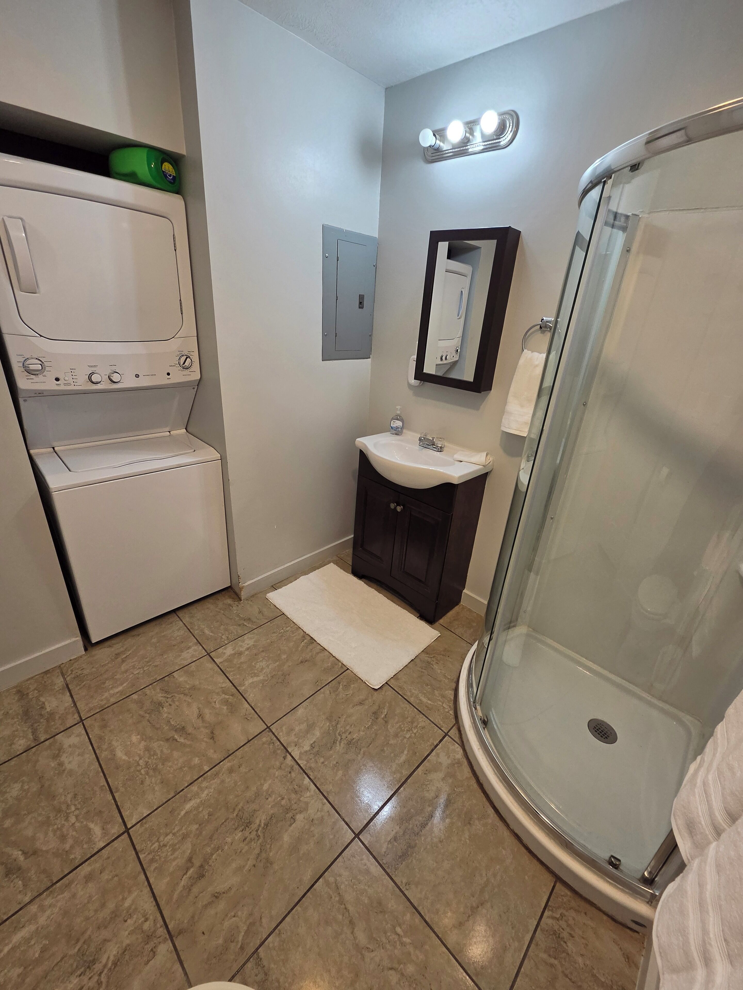 Shower, hair dryer, towels, toilet paper