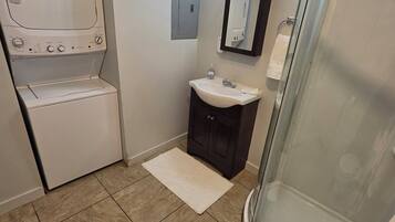 Shower, hair dryer, towels, toilet paper