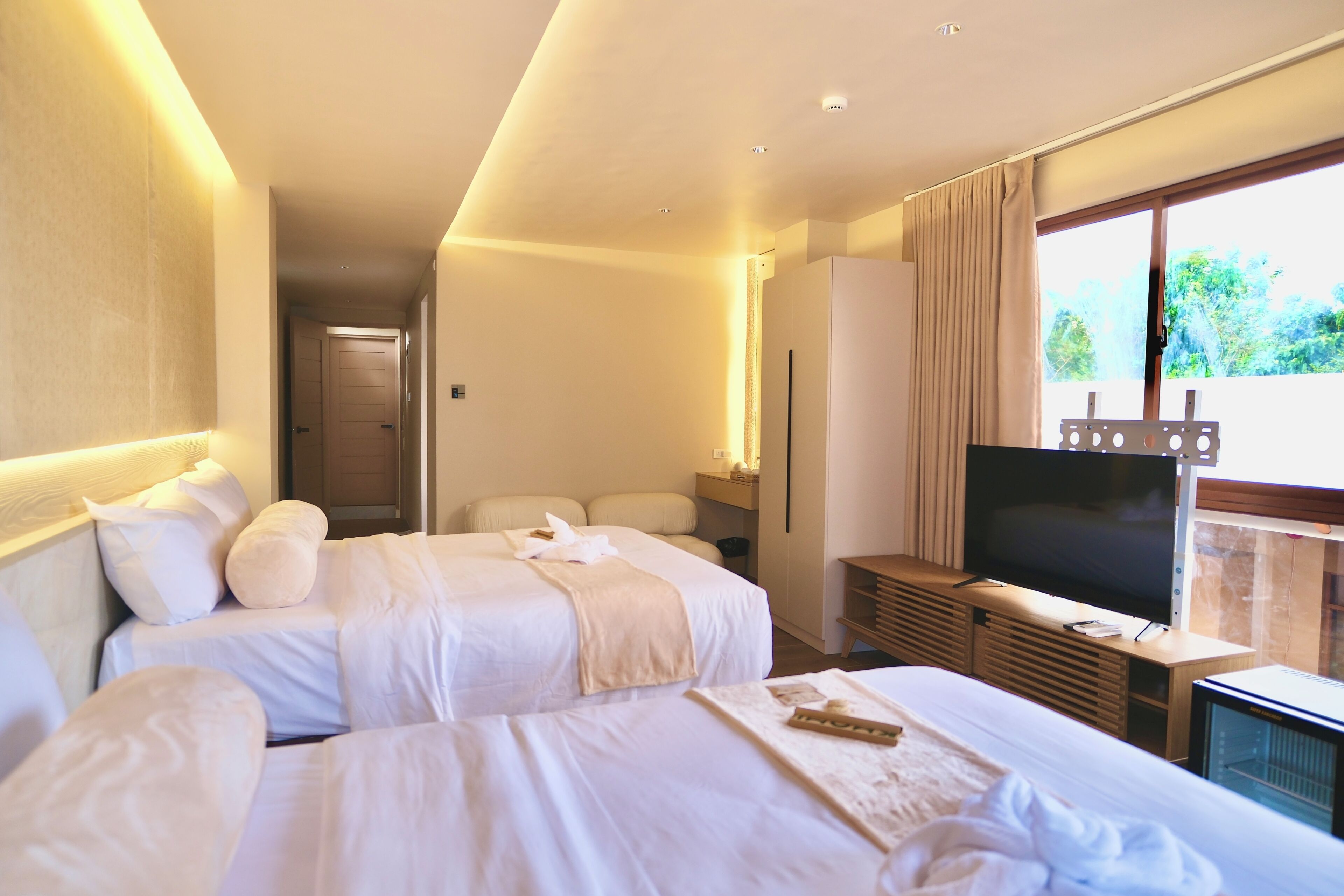 Superior Quadruple Room, Pool View | In-room safe, desk, laptop workspace, blackout drapes